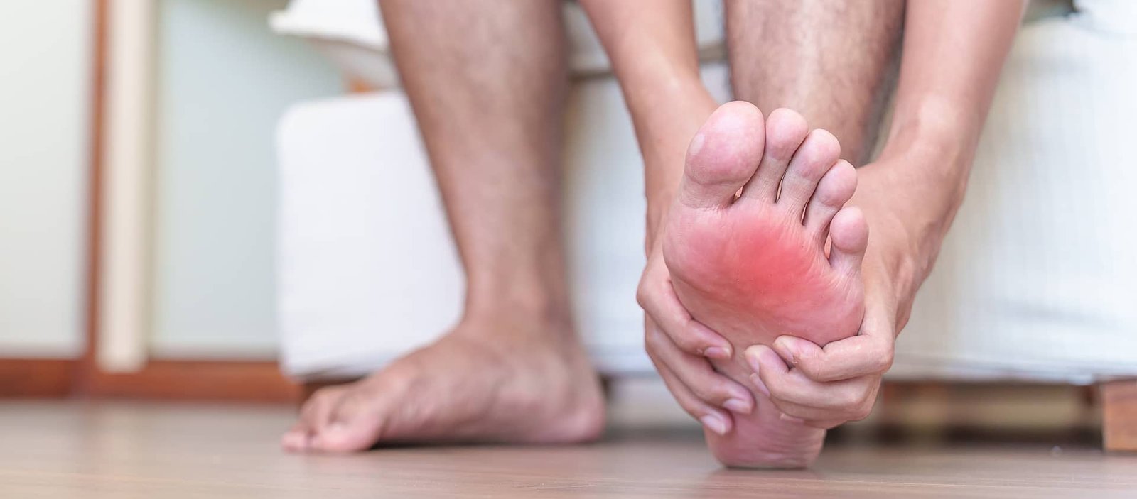 Patient experiencing intense heel pain from plantar fasciitis – a condition successfully treated with ESW shockwave therapy at Beyond Stem Cells Med Spa